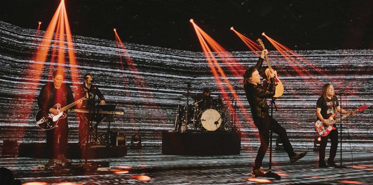 Wide shot of the full band performing the Grounded With The Goo Goo Dolls virtual rock show