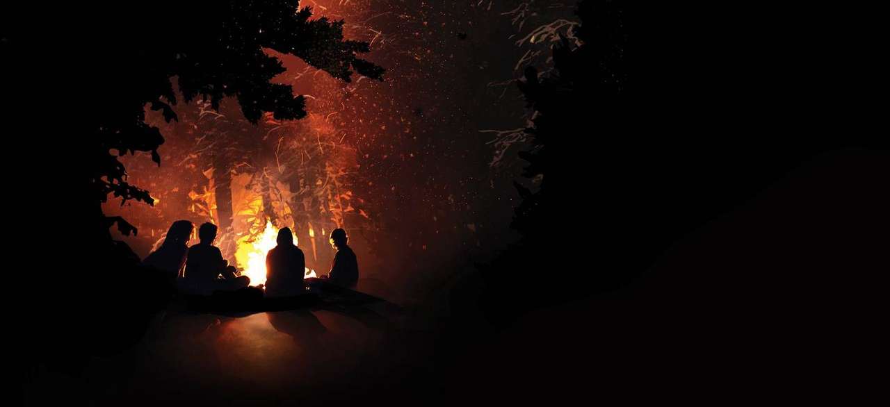 Campfire glowing at dusk in the Great Smoky Mountains, key art from the Peaceful Side of the Smokies campaign
